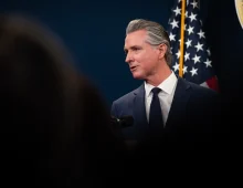 Gov. Gavin Newsom addresses the media during a press conference unveiling his revised 2026-27 budget proposal at the Capitol Annex Swing Space in Sacramento on May 14, 2026. Photo by Miguel Gutierrez Jr., CalMatters